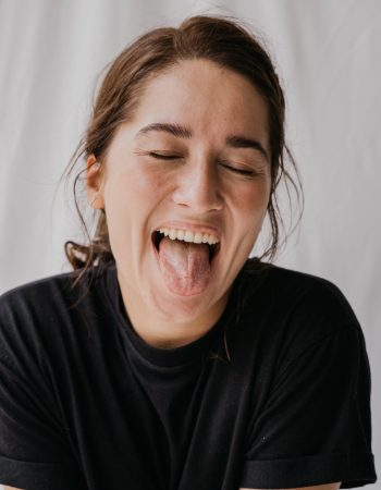 Woman with her mouth open confidently.