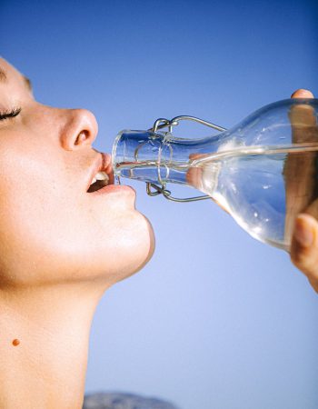 Drinking clean water out of a ikea glass bottle